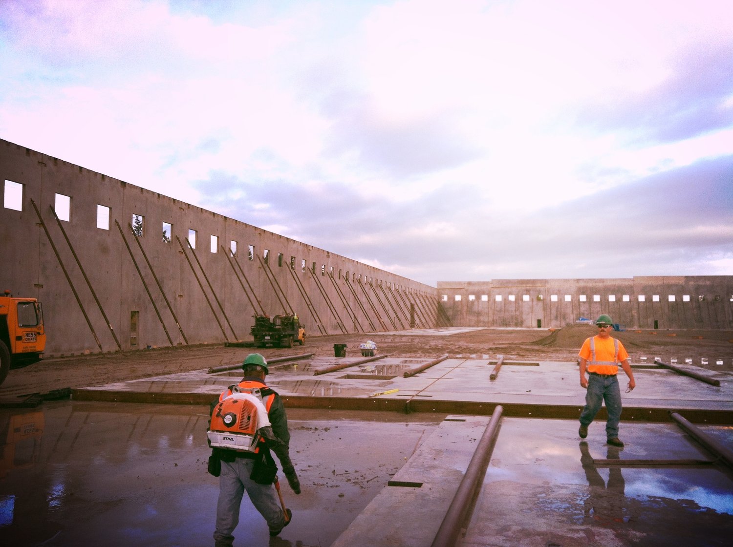 Niagara Bottling - tilt-up wall erected on braces with the erection crew